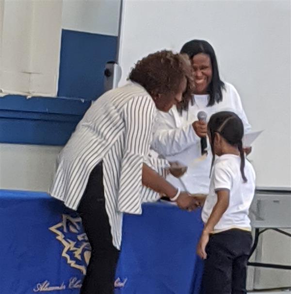  Principal gives award to PreK student